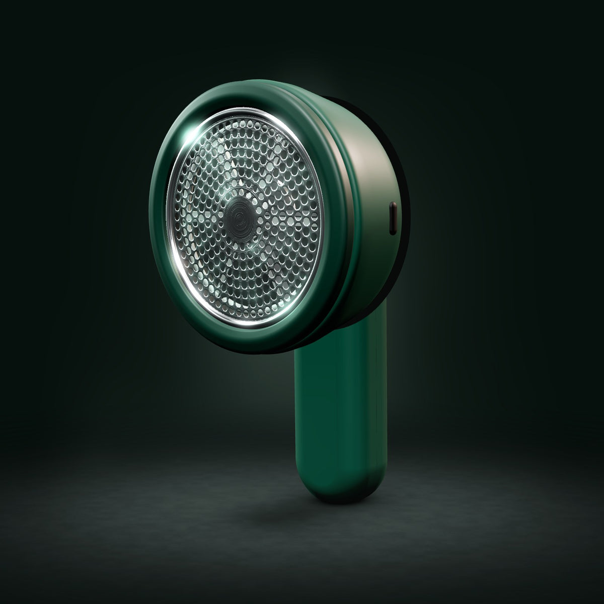 FreshFab lint remover 3D render: front view of the steel mesh head and dark green body